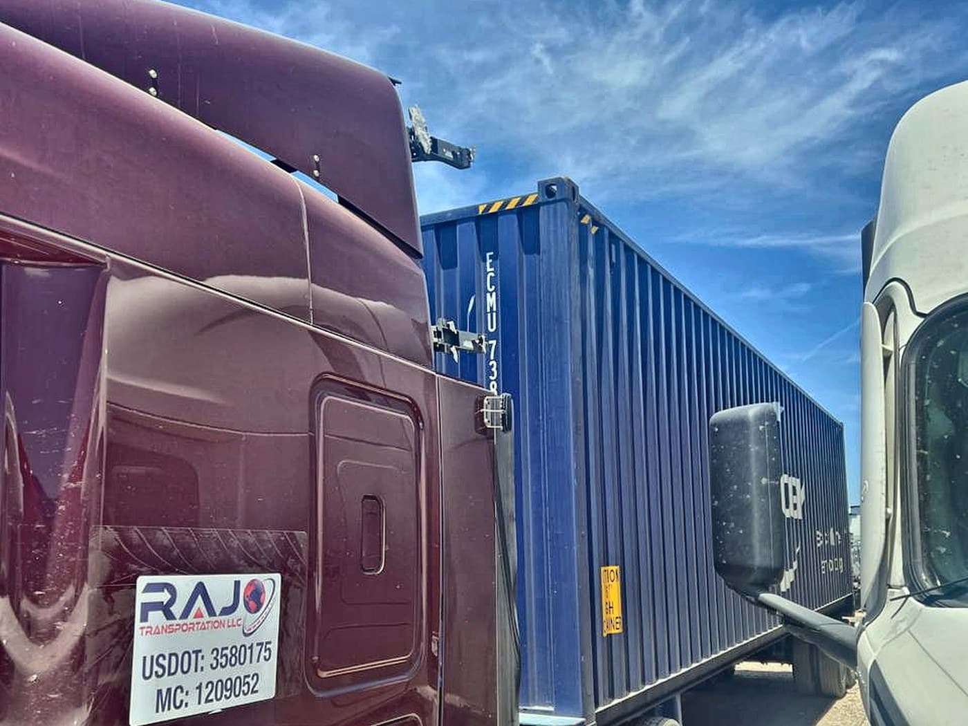 RAJO door decal showing USDOT 3580175 and MC 1209052 beside a container on chassis